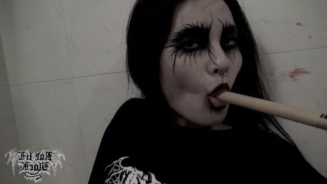 Bloody Asian girl masturbates her pussy with a thin stick in the bathtub